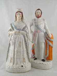 Appraisal: A large pair of th Century Staffordshire figures '' Queen