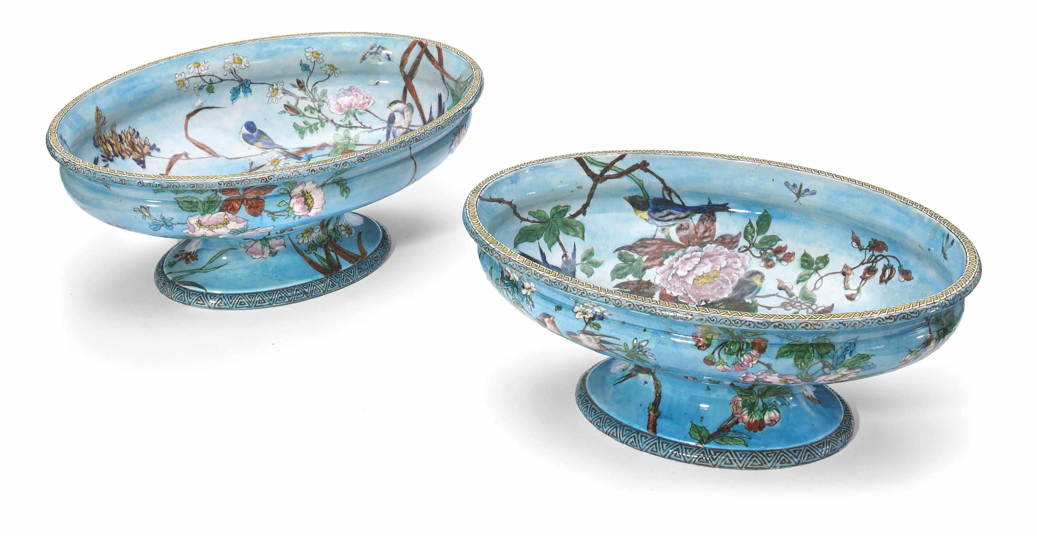 Appraisal: An imposing pair of French glazed earthenware centerpiece pedestal bowls