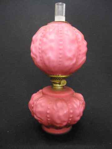 Appraisal: Victorian Cranberry Satin Art Glass Miniature OilLamp matching globe cased