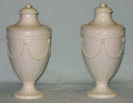 Appraisal: PAIR OF WEDGWOOD QUEEN'S WARE URNS Each lidded footed vase