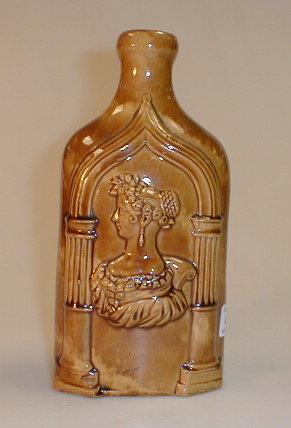 Appraisal: A treacle glaze stoneware slab sided bottle moulded in relief