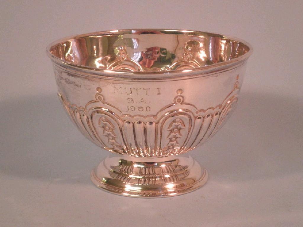 Appraisal: A part fluted silver sugar bowl embossed with bell flowers