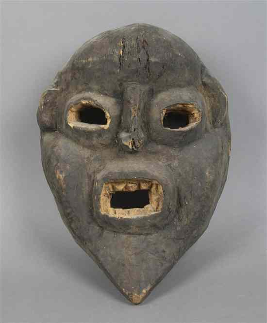 Appraisal: A Carved Wood Mask West African of ovoid tapering form