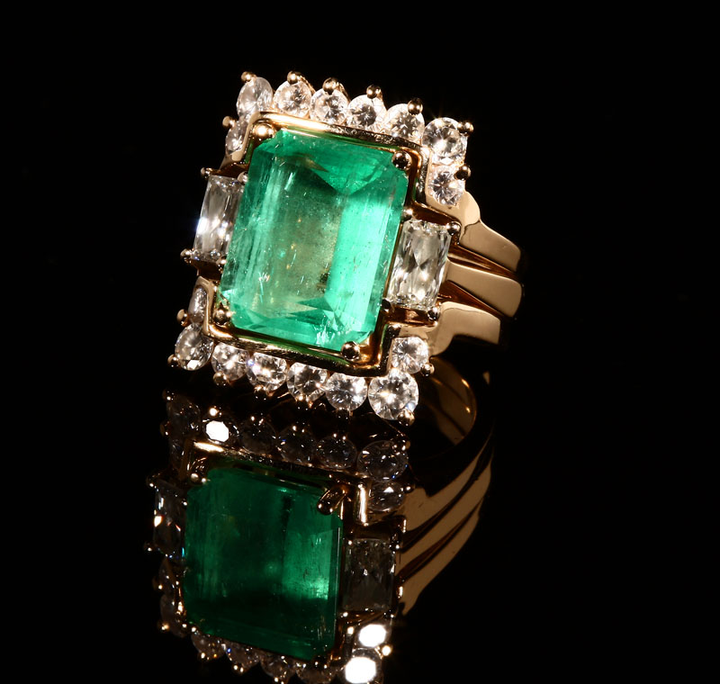 Appraisal: A K yellow gold emerald and diamond ring with matching