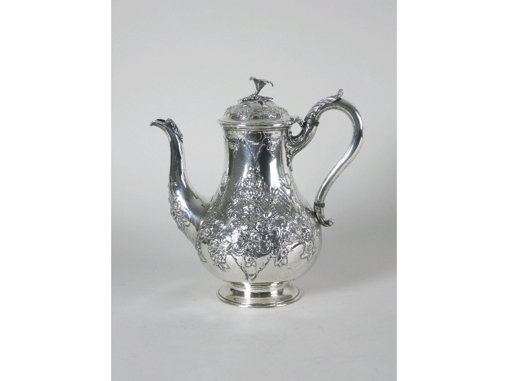 Appraisal: A Victorian baluster Coffee Pot with floral embossing and engraved