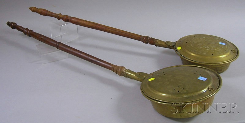 Appraisal: Two Brass Bedwarmers with Turned Wood Handles