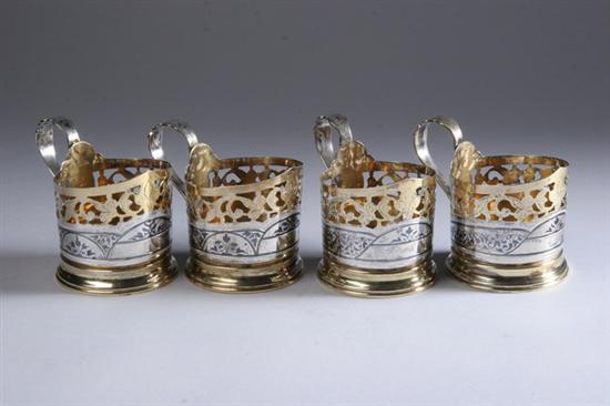 Appraisal: FOUR SOVIET RUSSIAN SILVER CUP HOLDERS th century hammer and