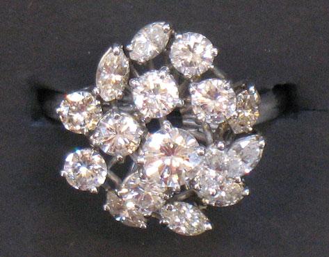 Appraisal: A DIAMOND CLUSTER RING with round brilliant-cut and marquise diamonds