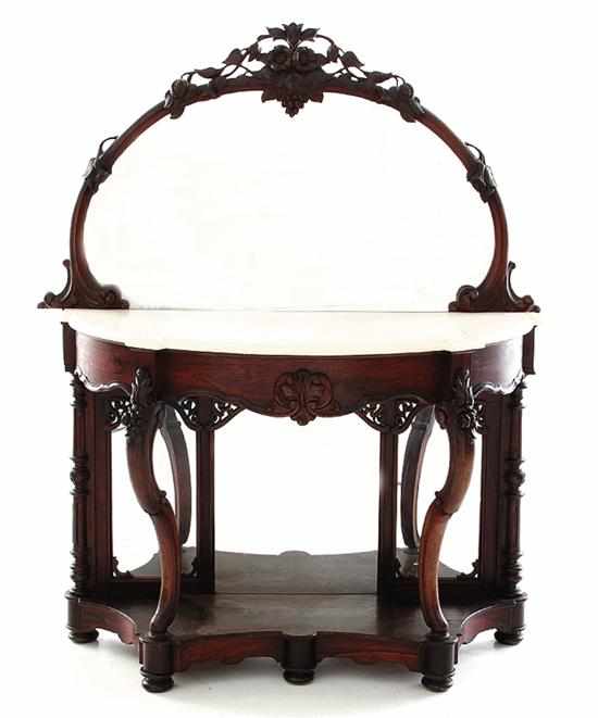 Appraisal: Rococo Revival carved mahogany marbletop console table New York last