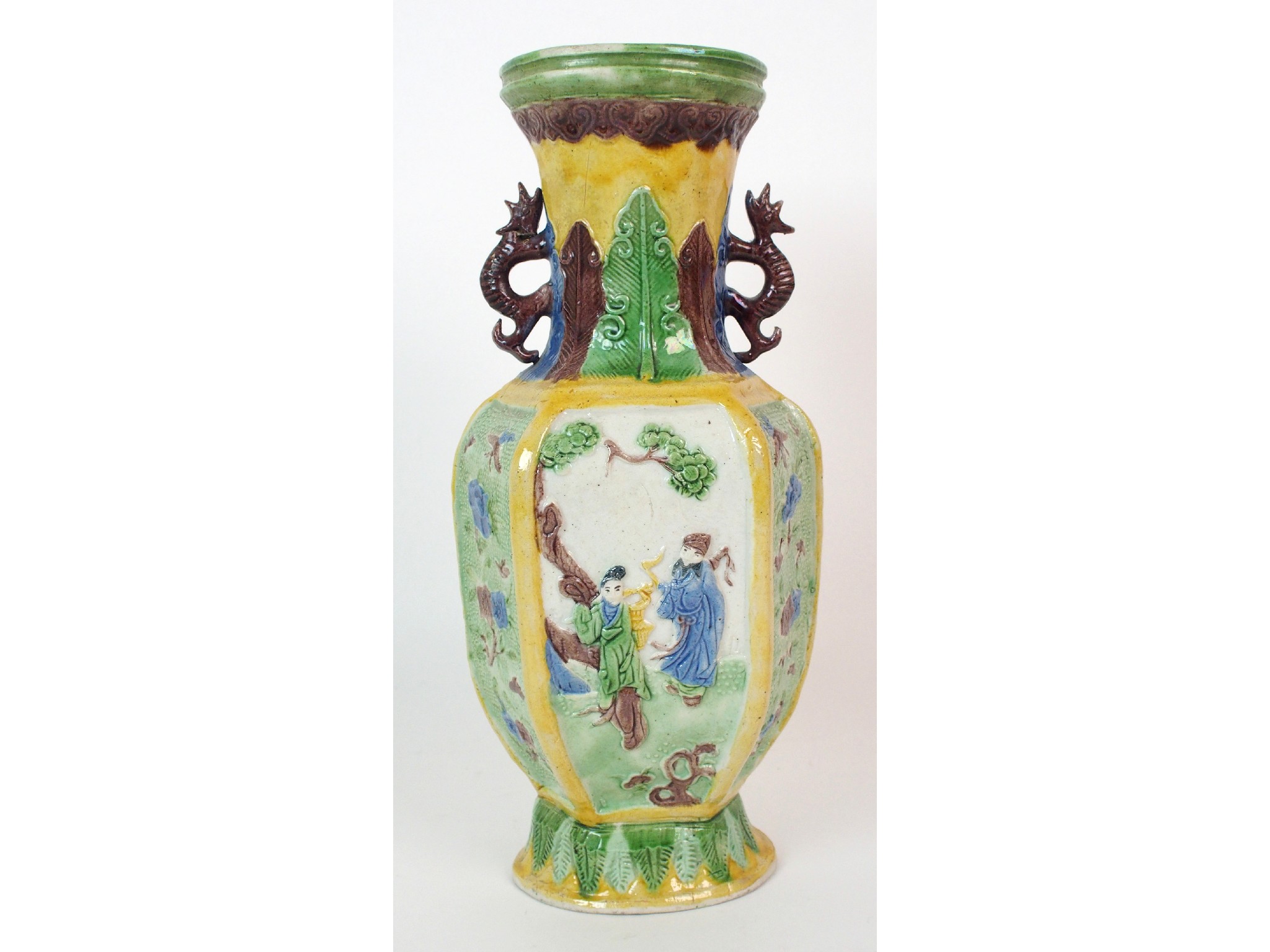 Appraisal: A Chinese hexagonal relief moulded two-handled vasedecorated with figures and