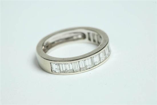 Appraisal: DIAMOND BAND RING Diamond baguette K white gold band with