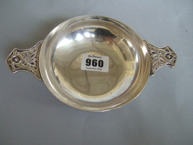 Appraisal: A silver twin handled Quaich the handles decorated with mythological