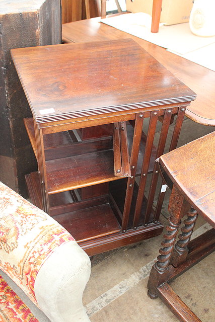 Appraisal: AN EARLY TH CENTURY MAHOGANY REVOLVING BOOKCASE partially slatted sides