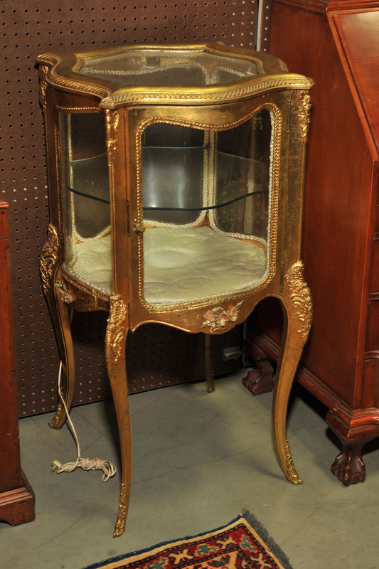 Appraisal: VITRINE Gold vitrine with curved front and sides single glass