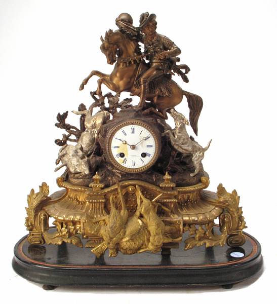 Appraisal: A patinated metal figural mantel clock encased in a glass