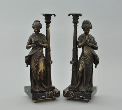 Appraisal: A Pair of Bronze Figurative Candlesticks Marked Tiffany Co Paris