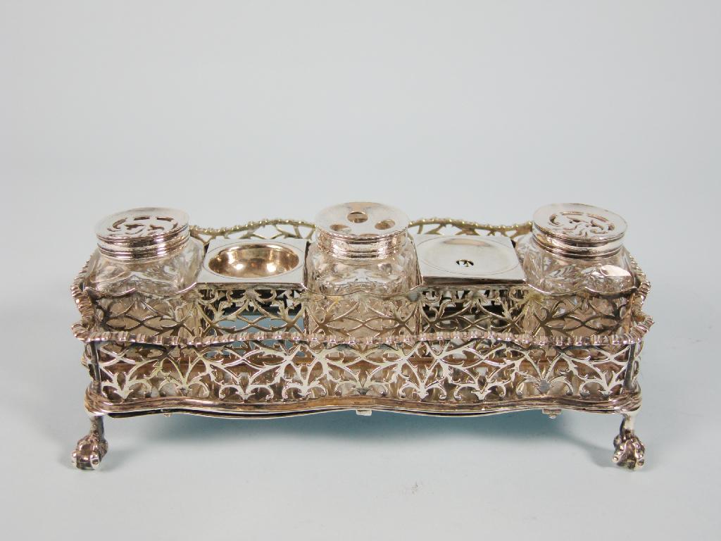 Appraisal: A George III shaped rectangular Inkstand with pierced gallery fitted