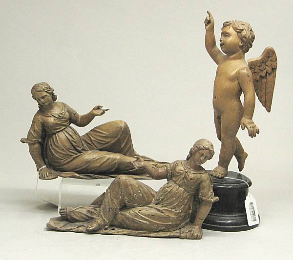 Appraisal: Three Baroque carved walnut figures th century Comprising two reclining