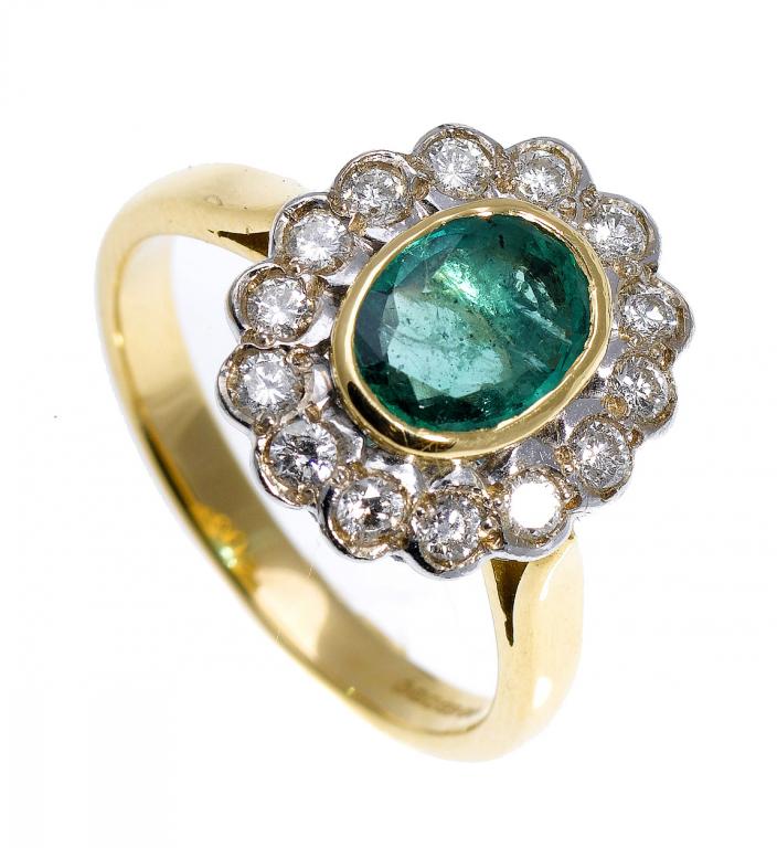 Appraisal: AN EMERALD AND DIAMOND CLUSTER RING the larger oval emerald