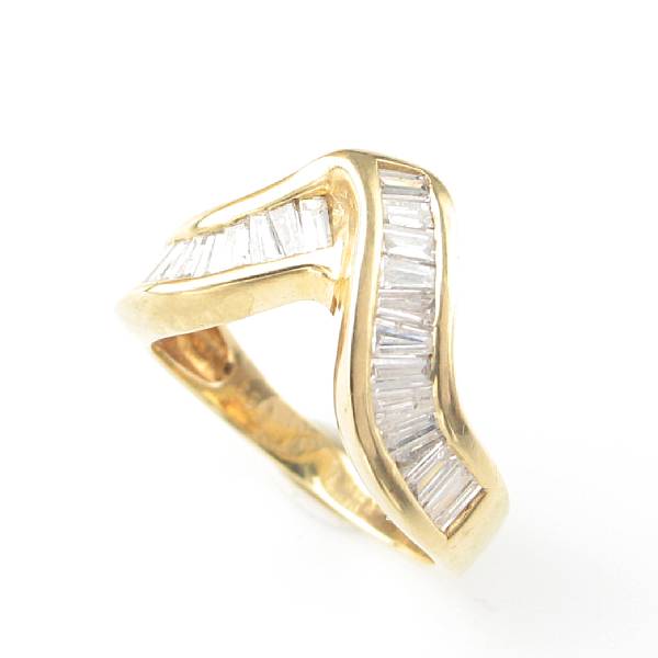 Appraisal: A baguette-cut diamond and k gold ring estimated weight of