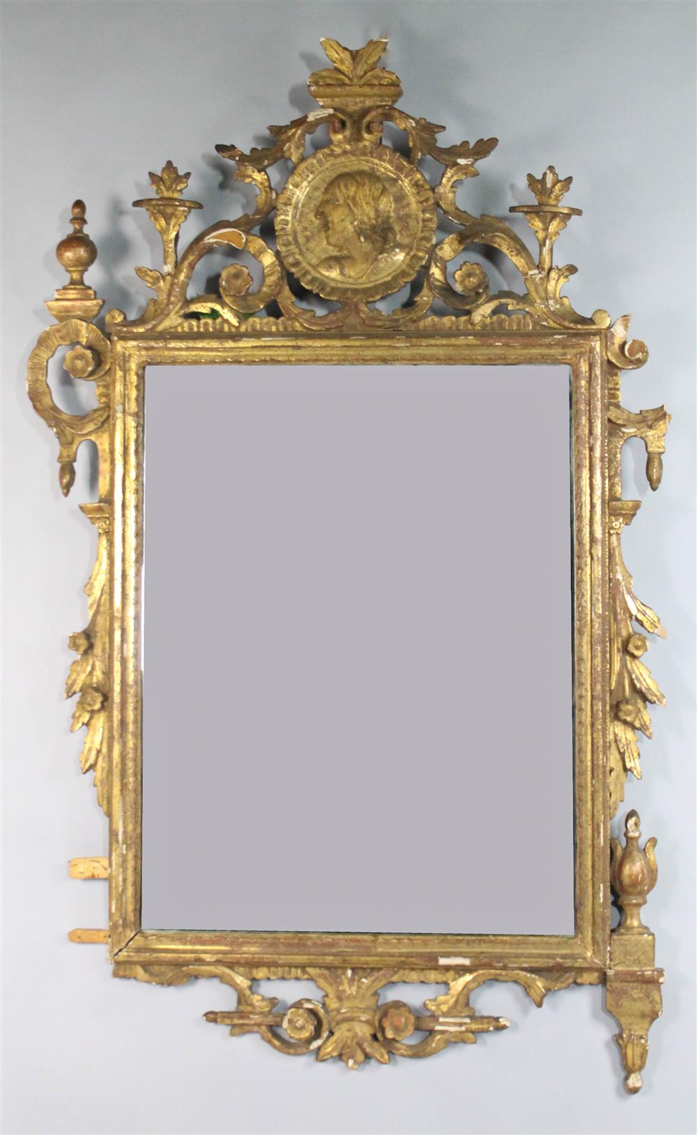 Appraisal: CLASSICAL CARVED GILT WOOD MIRROR TH C of scrolling form