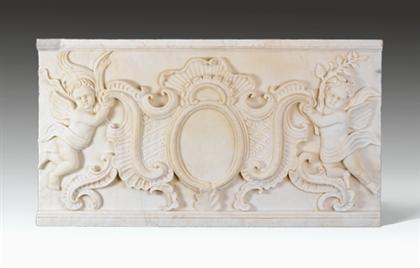 Appraisal: Continental carved marble plaque Featuring a carved cartouche supported by