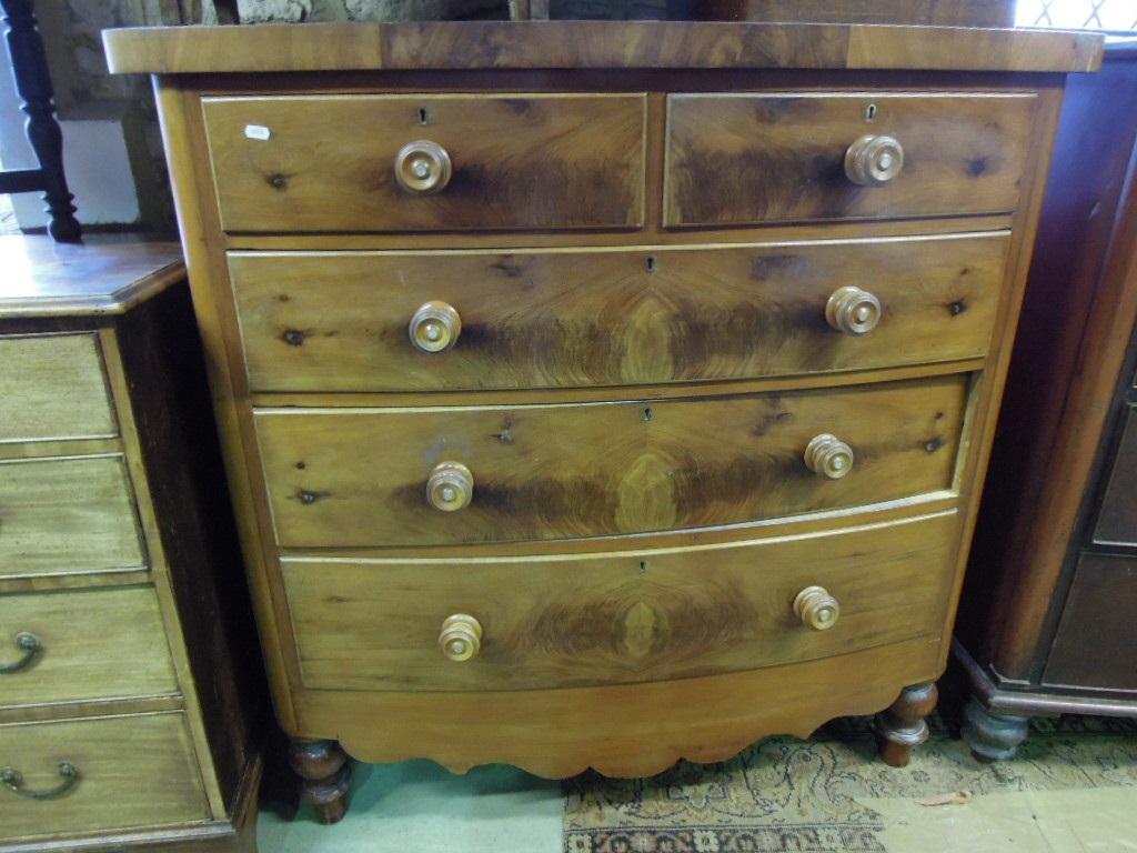 Appraisal: A Victorian mahogany bow fronted chest fitted with an arrangement