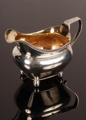 Appraisal: A George III silver and silver gilt cream jug London