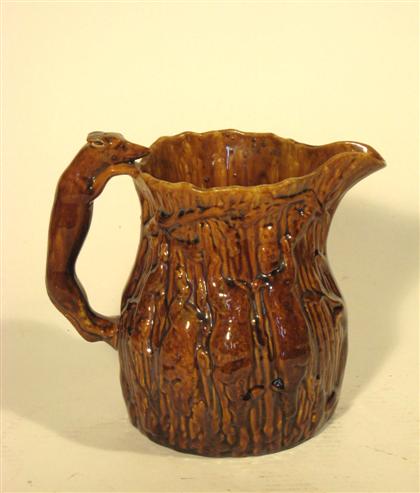 Appraisal: Rockingham glazed molded hound pitcher th century H in Imperfections