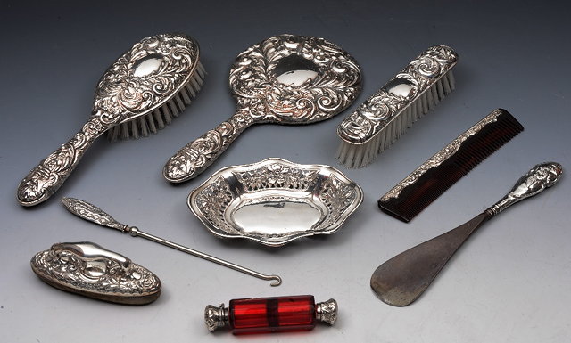 Appraisal: A COLLECTION TO INCLUDE two silver backed brushes a comb