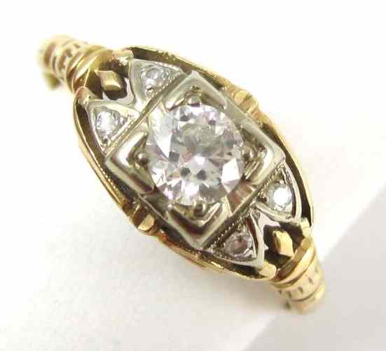 Appraisal: DIAMOND AND FOURTEEN KARAT GOLD RING a pair of round-cut