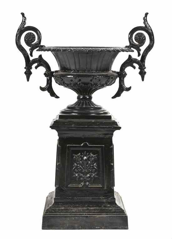 Appraisal: A Victorian Style Cast Iron Urn on Pedestal the urn