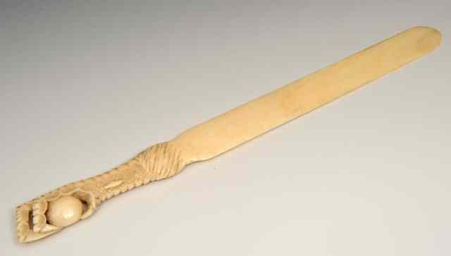 Appraisal: A CARVED IVORY PAPER KNIFE