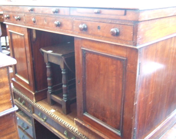 Appraisal: A Victorian mahogany twin pedestal desk circa the top with