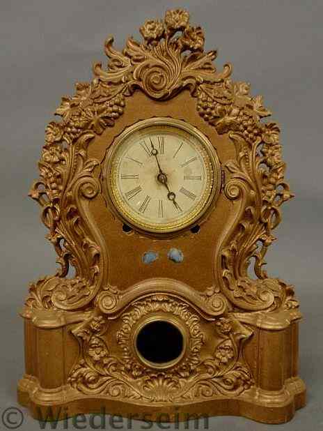 Appraisal: Iron shelf clock with gilt paint decoration late th c