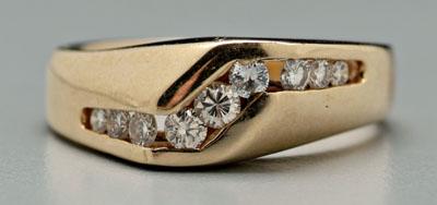 Appraisal: Gold and diamond ring channel set with nine round brilliant-cut