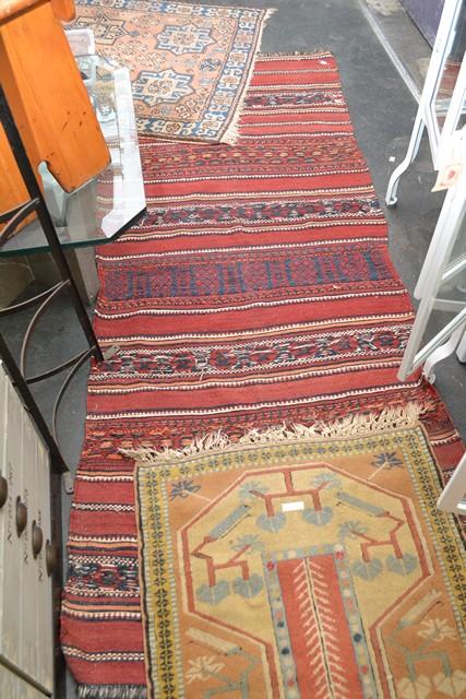 Appraisal: A KILIM RUG IN BURGANDY TONES