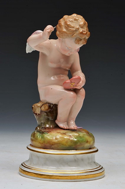 Appraisal: A MEISSEN FIGURE of a Cupid with love heart on