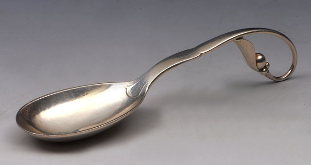 Appraisal: A GEORG JENSEN SILVER JAM SPOON with leaf and berry