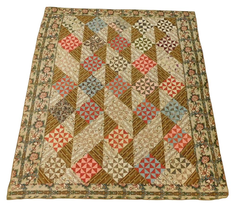 Appraisal: TEXTILE Pieced calico quilt with pinwheel-type blocks on point c