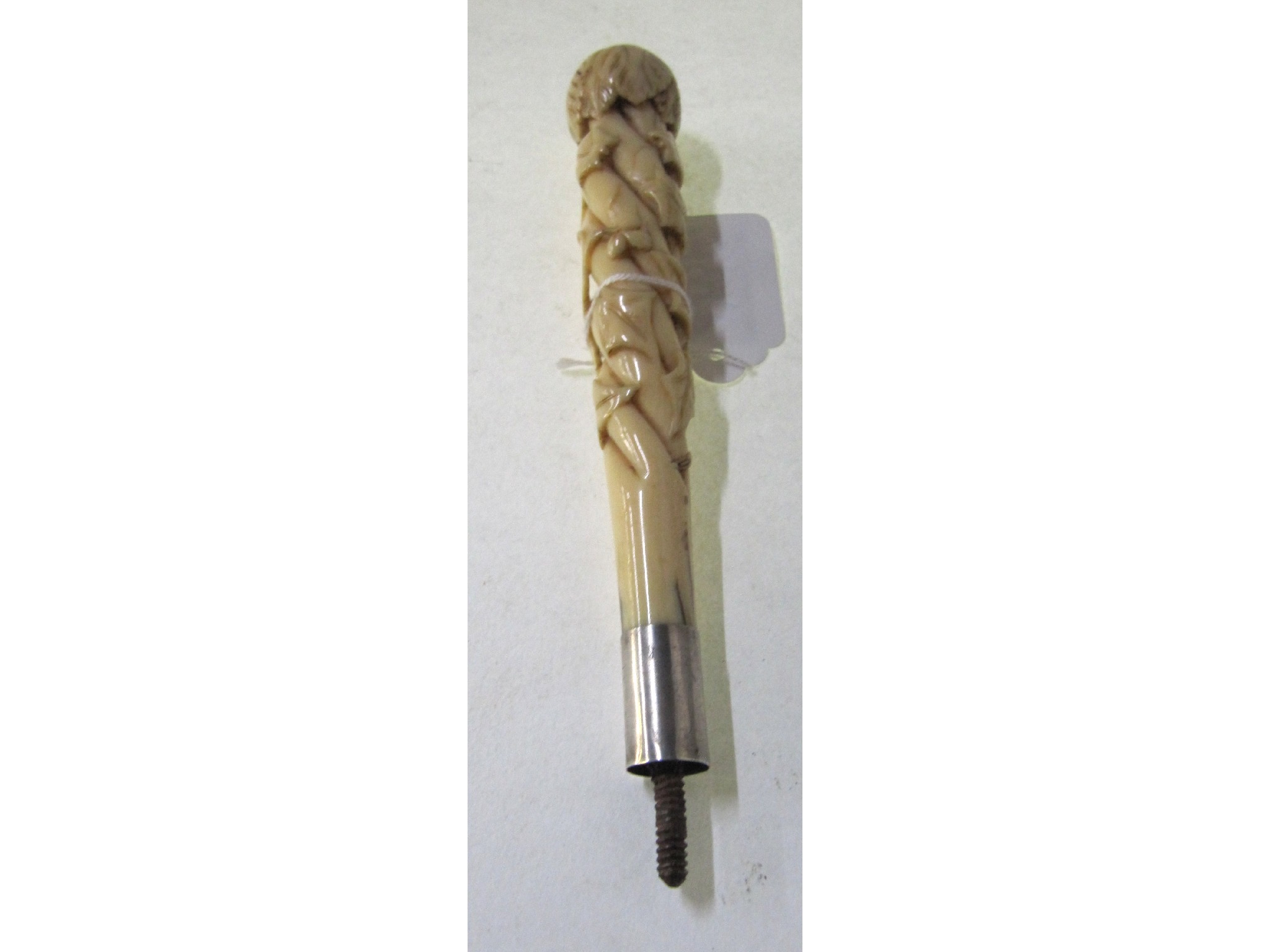 Appraisal: A carved ivory parasol handle