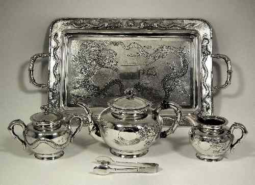 Appraisal: A Chinese silvery metal three piece tea service the bulbous