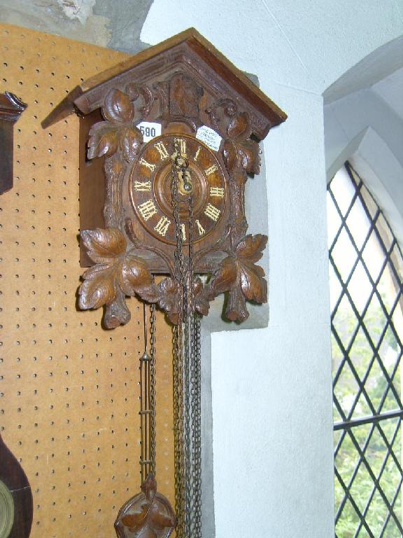 Appraisal: A late th century Tyrolean cuckoo clock of usual chalet