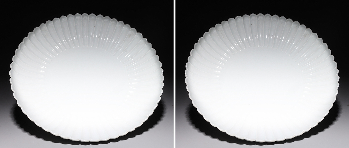 Appraisal: Pair of Chinese white glazed porcelain chargers with scallop rim