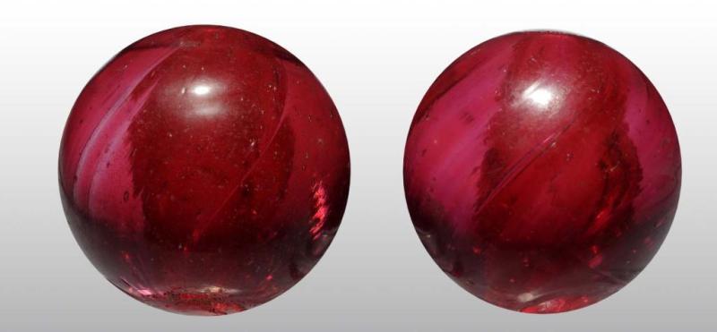 Appraisal: Lot of Double Pontil Handmade Marbles Description Very unusual cranberry