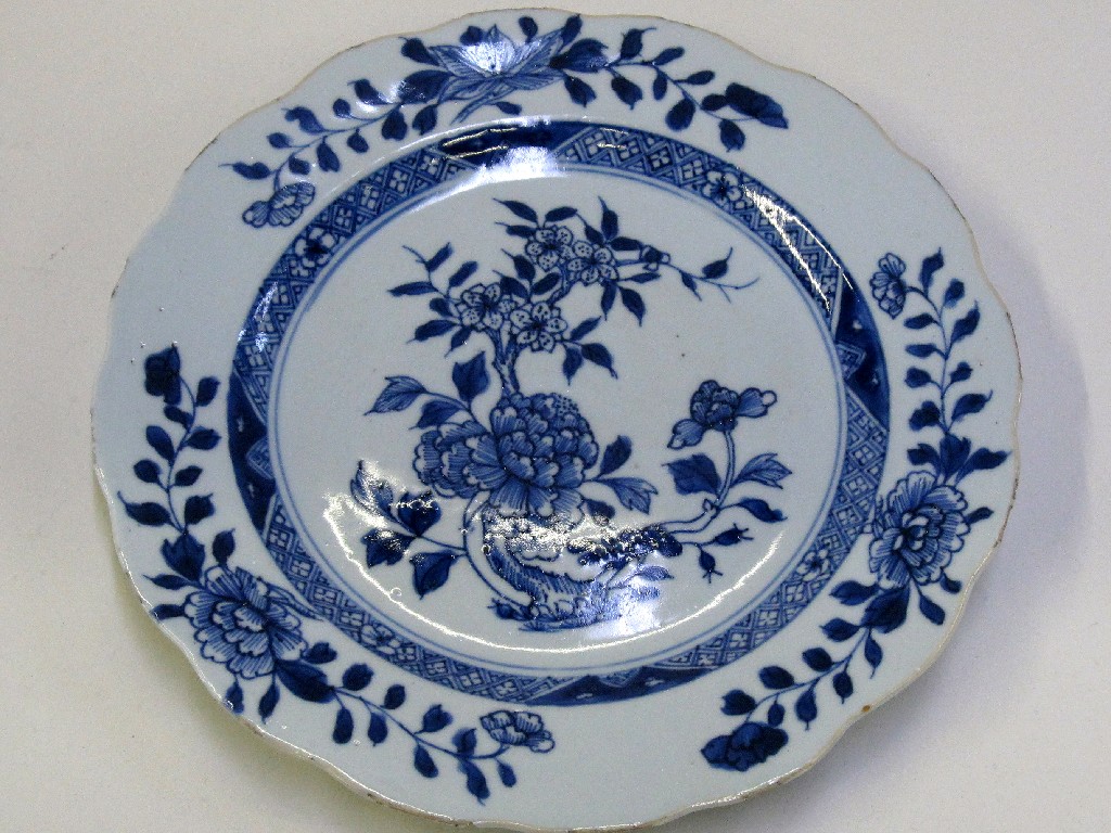 Appraisal: Oriental blue and white plate with scalloped edge and a