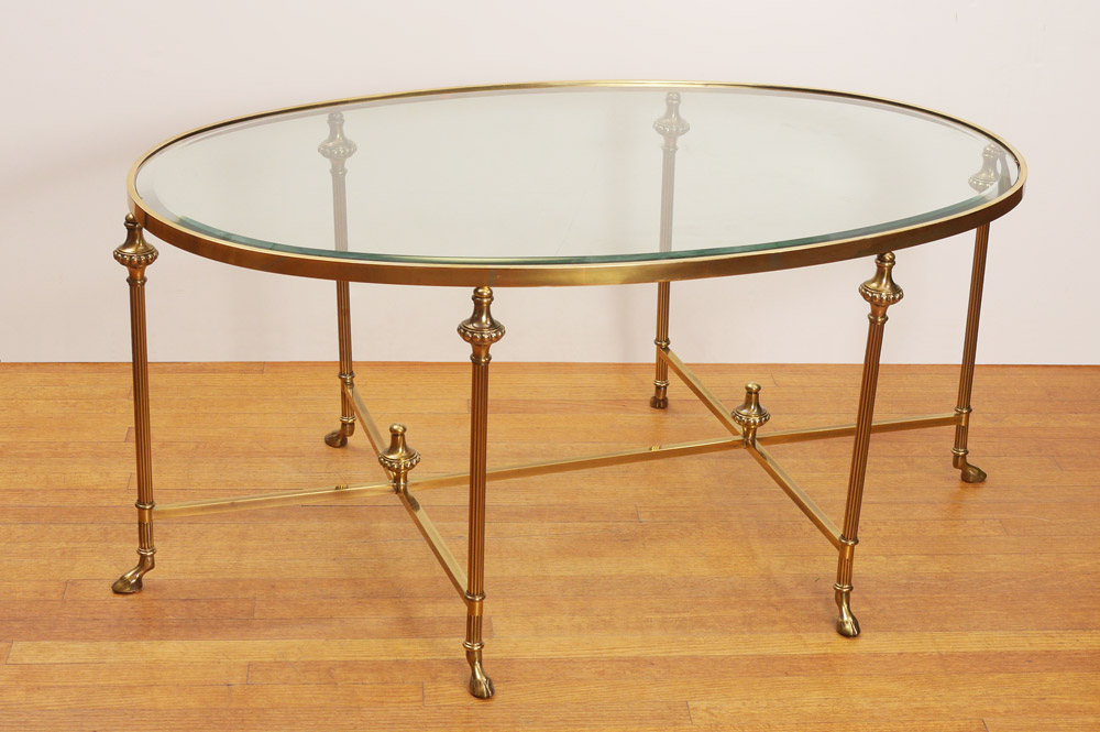 Appraisal: GIO PONTI BRASS BASE TABLE Oval beveled glass over a