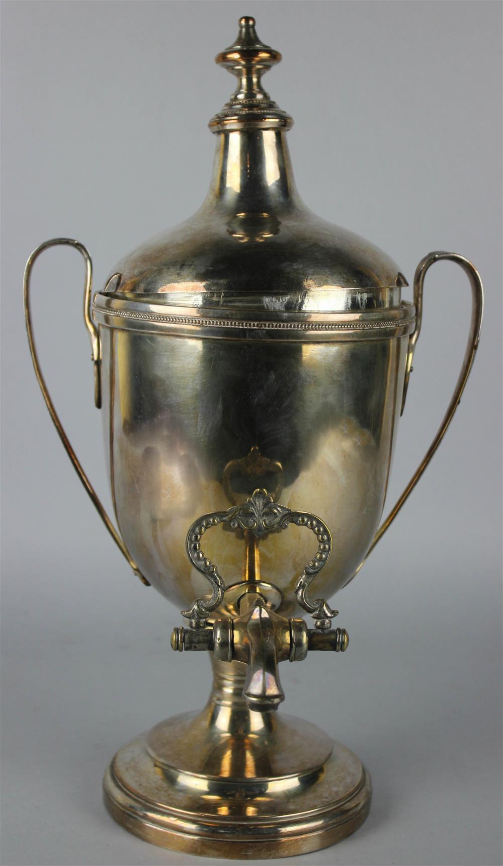 Appraisal: A CHINESE WHITE METAL TEAPOT WITH WARMING STAND the swing-handled