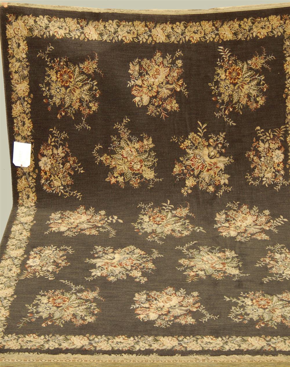 Appraisal: POSITANO MACHINE MADE WOOL RUG having a bouquet center design