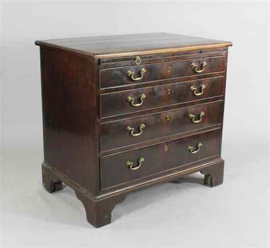 Appraisal: A George III mahogany chest of four graduated long drawers